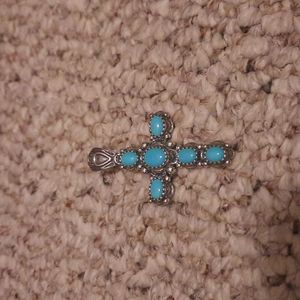 Silver and blue stone cross pendant